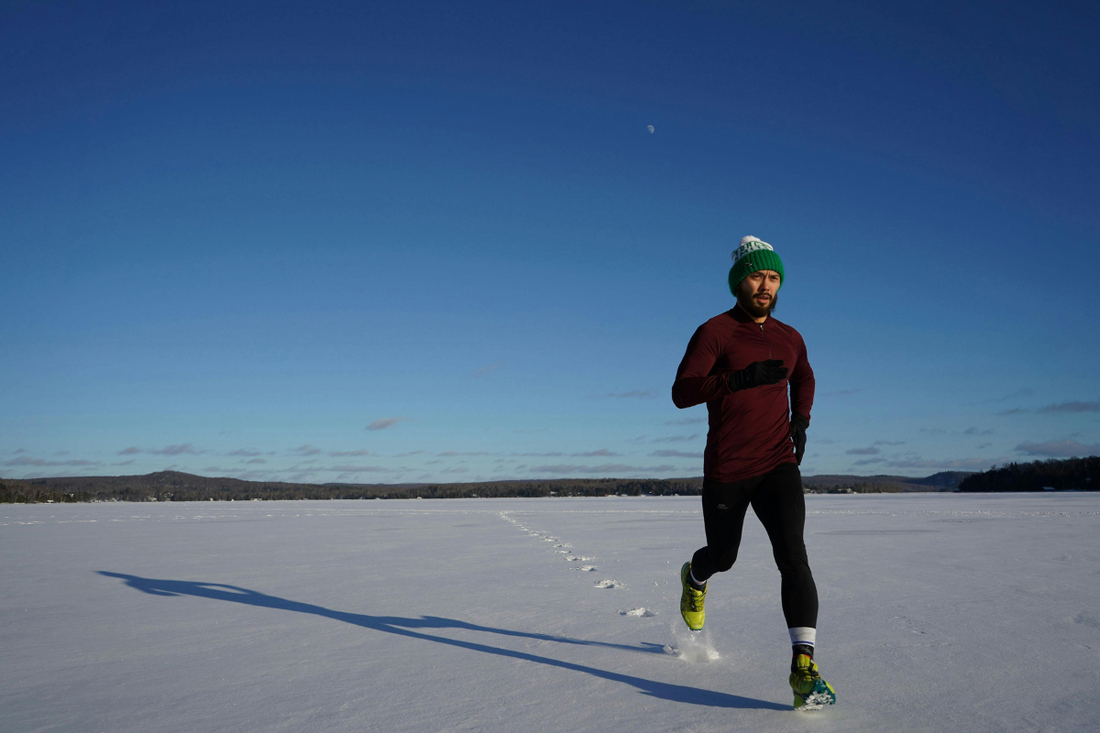 Man running in snow - ice bath weight loss blog